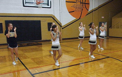 Image: The varsity squad performs a cheer for the campers.