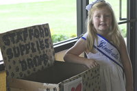 Image: Azlin Itson, 5, is a kindergardener attending Stafford Elementary in Italy is helping collect donated school supplies for her fellow schoolmates.