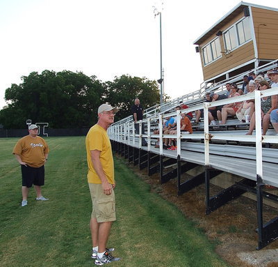 Image: Italy Gladiators’ first-year head football coach, Charles Tindol, addresses parents and players along Italy’s home sideline at historic Willis Field as Tindol and his coaching staff gear up for Midnight Madness.