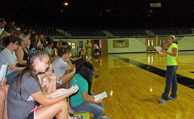 Image: First-year Italy Lady Gladiator Volleyball head coach, Morgan Mathews, addresses parents and players during a 7:30 p.m. meeting inside Italy Coliseum on Sunday evening as part of Midnight Madness with 12:01 a.m. practice time soon to arrive.