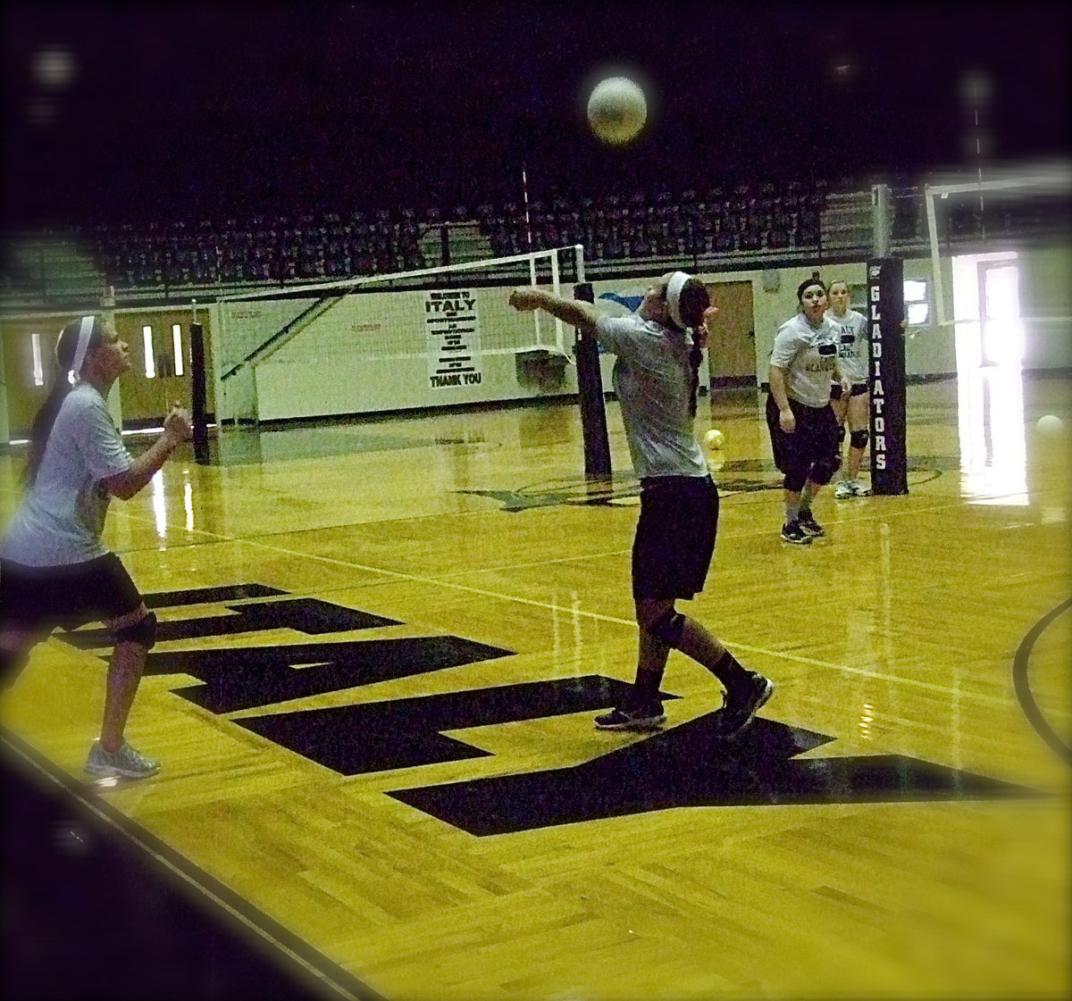 Image: Junior setter Bailey Eubank sets the ball for the offense as Lillie Perry and Monserrat Figueroa await the result.