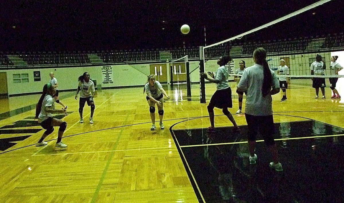 Image: Junior hitter Kelsey Nelson lunges in to keep the ball alive on the offense.