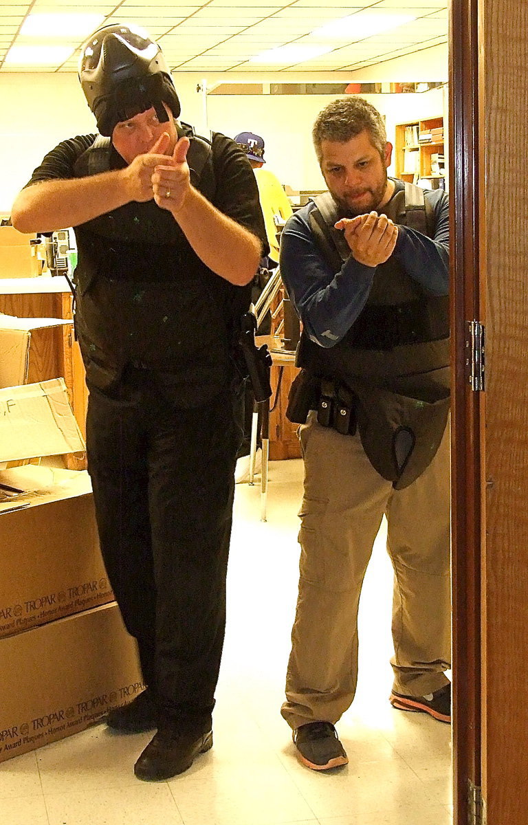 Image: Italy Police Chief Diron Hill and Officer Pedro Gonzalez do a walk thru on how to check a room thru a doorway before entering to check for suspects.