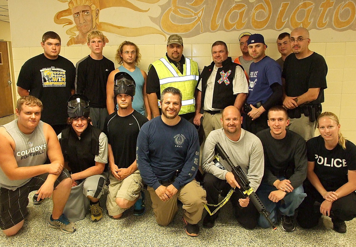 Image: Officers and student volunteers who participated in the Response To Active Shooter Training – School Based exercises this past Saturday inside Italy High School are (Back row) Kevin Roldan, Cody Boyd, Shad Newman, Firearms Instructor Eric Tolliver, Volunteer Chad Raney, Italy Firefighter Brad Chambers, Officer Daniel Pitts, Zain Byers, Officer Mike Stevens. (Front row) Colin Newman, Kyle Fortenberry, Chase Hamilton, Officer Pedro Gonzalez, Officer Shawn Martin, Officer Nick Moore and Shelbee Landon.