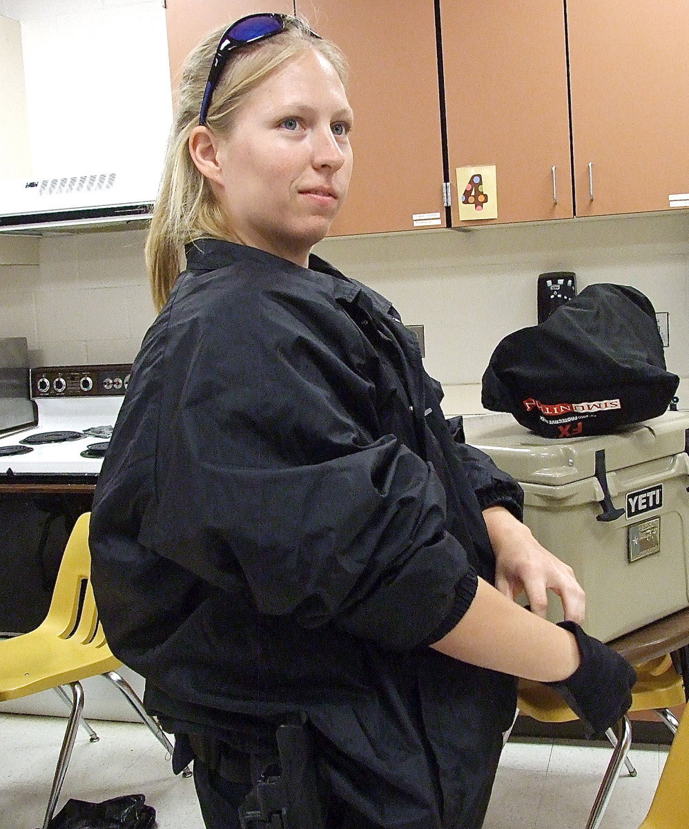 Image: Italy Police Officer Shelbee Landon puts on protective gear in preparation of an upcoming training scenario in which gunmen have overtaken Italy High School.