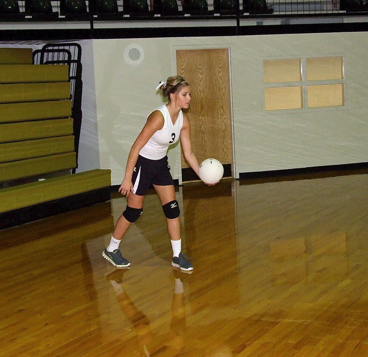 Image: Italy JV Lady Gladiator Halee Turner(3) prepares to serve.