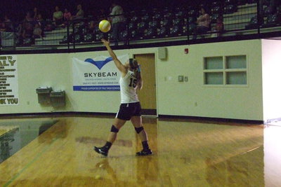 Image: Italy’s Jaclynn Lewis(15) serves to Kerens.