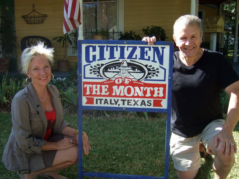 Image: Victor Carera with his wife pose for their picture of in front of the Citizen of the Month sign!