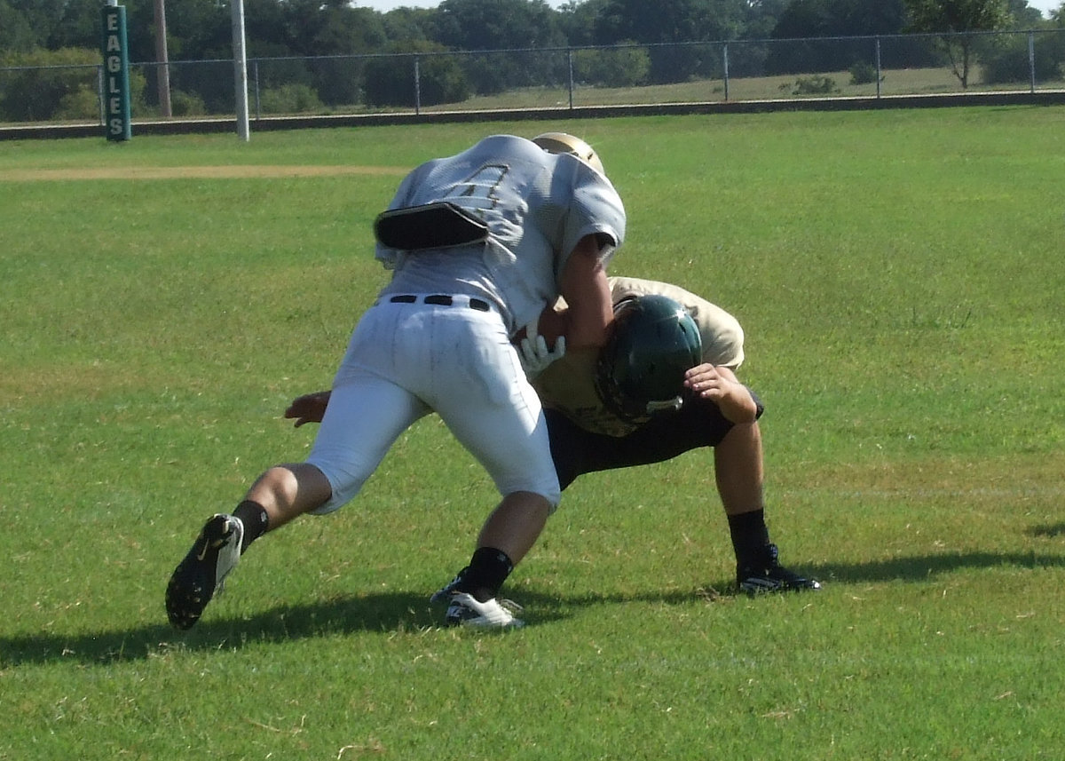 Image: Italy Gladiator Shad Newman(4) rambles over an Eagle defender for positive yards to help Italy steam roll Valley Mills on their home turf 6-0 in Saturday’s scrimmage. Newman was a workhorse for the Gladiators as a back, a receiver and at inside linebacker on defense.