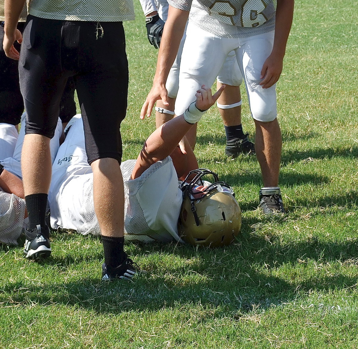 Image: Zain Byers(60) expresses his joy after recovering a fumble stripped from the ball carrier by his cousin John Byers. The effort by the Cousins of Chaos was the second forced turnover by Italy’s defense during the scrimmage.