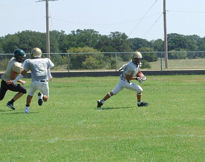Image: Levi McBride(3) intercepts a Valley Mills pass attempt late in the scrimmage, gets a block from Joe Celis(9) and then turns up field behind teammate Trevon Robertson and heads toward the end zone before the play was whistled dead for player safety It was Italy’s 3rd forced turnover on the day.