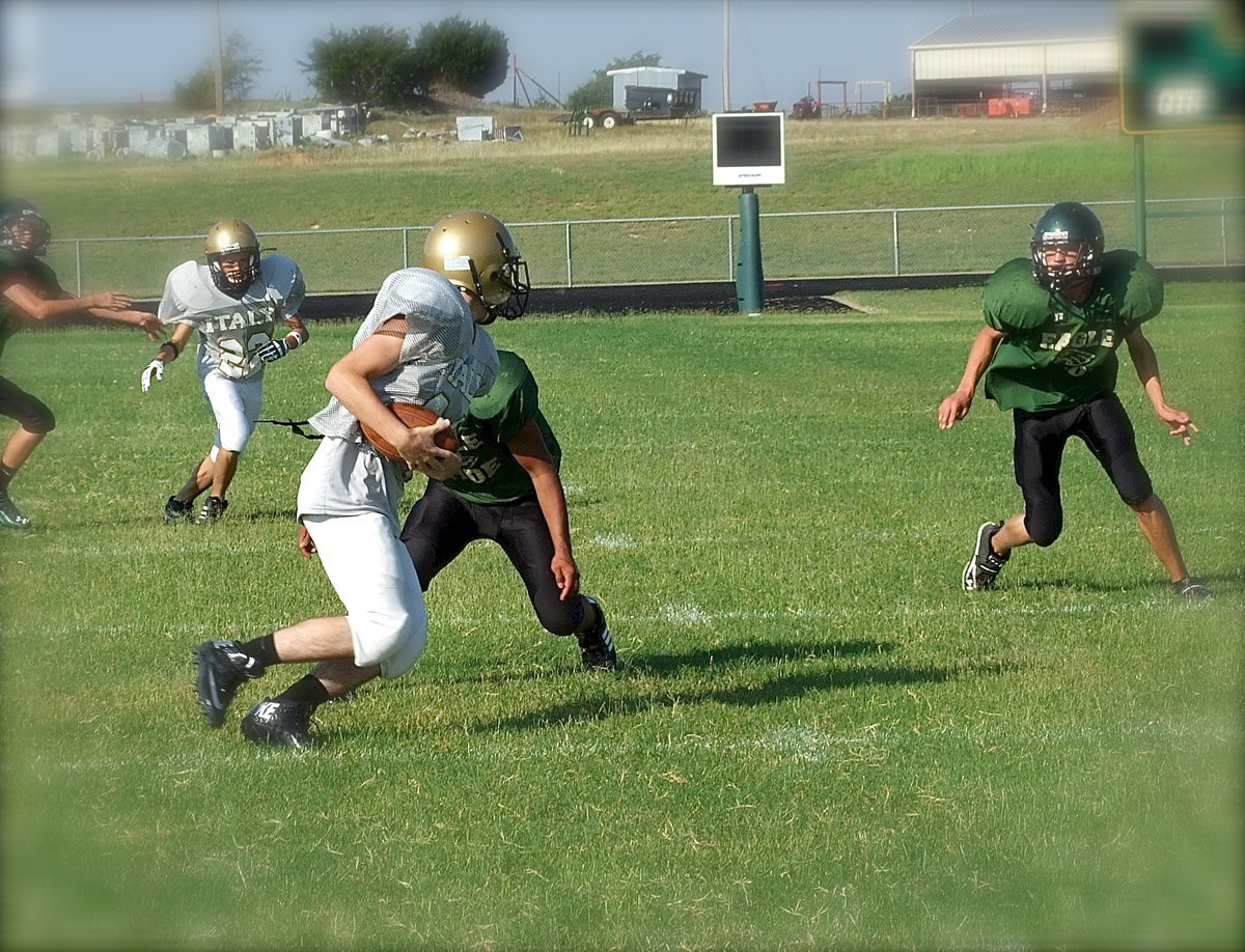 Image: Making his first ever career catch is Italy JV Gladiator, Aaron Latimer, who slipped a couple of defenders for extra yards before being gang tackled by the Eagles.