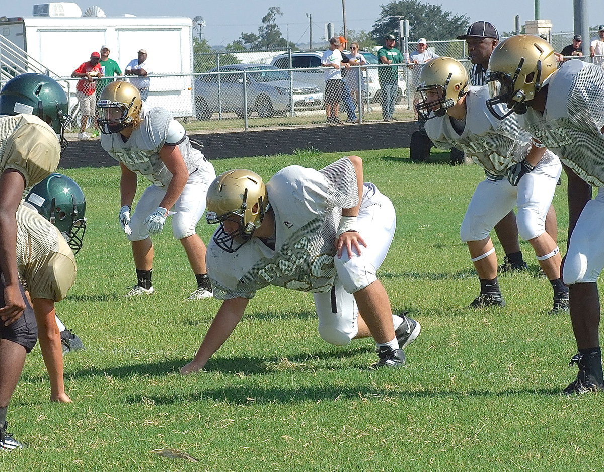 Image: Shad Newman(4), Zain Byers(50), Coby Bland(44) and TaMarcus Sheppard(8) settle in on defense against Valley Mills.