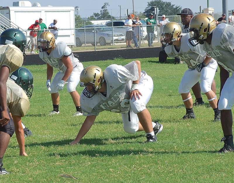 Image: Shad Newman(4), Zain Byers(50), Coby Bland(44) and TaMarcus Sheppard(8) settle in on defense against Valley Mills.