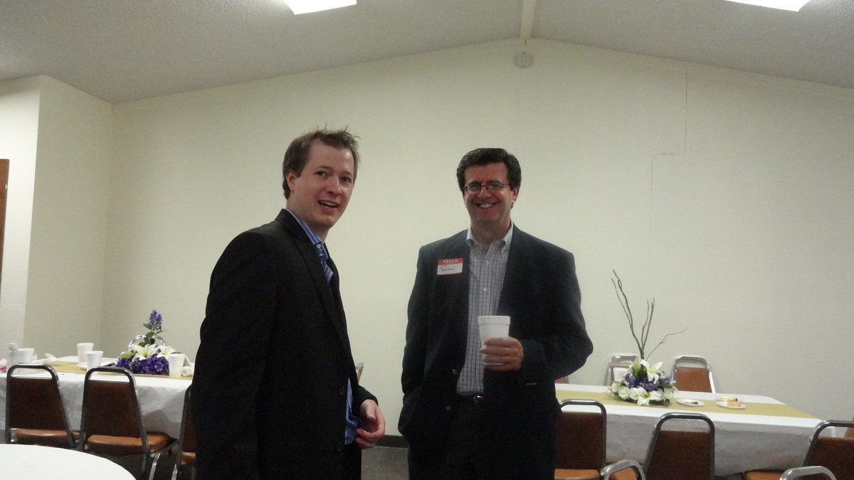 Image: Former pastor Jeff Bankhead visits with current pastor Joseph Barrett during Central Baptist Church’s 110th anniversary celebration Sunday.