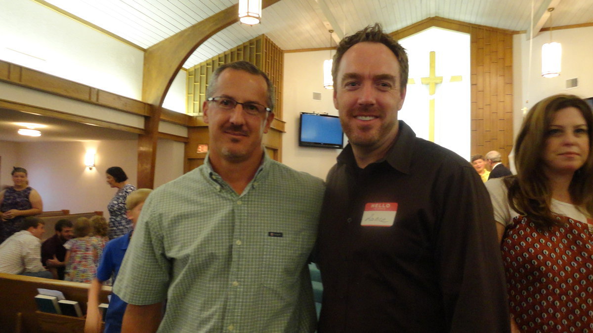 Image: Kyle Holley reminisces with Lance Logan who grew up at Central Baptist Church.