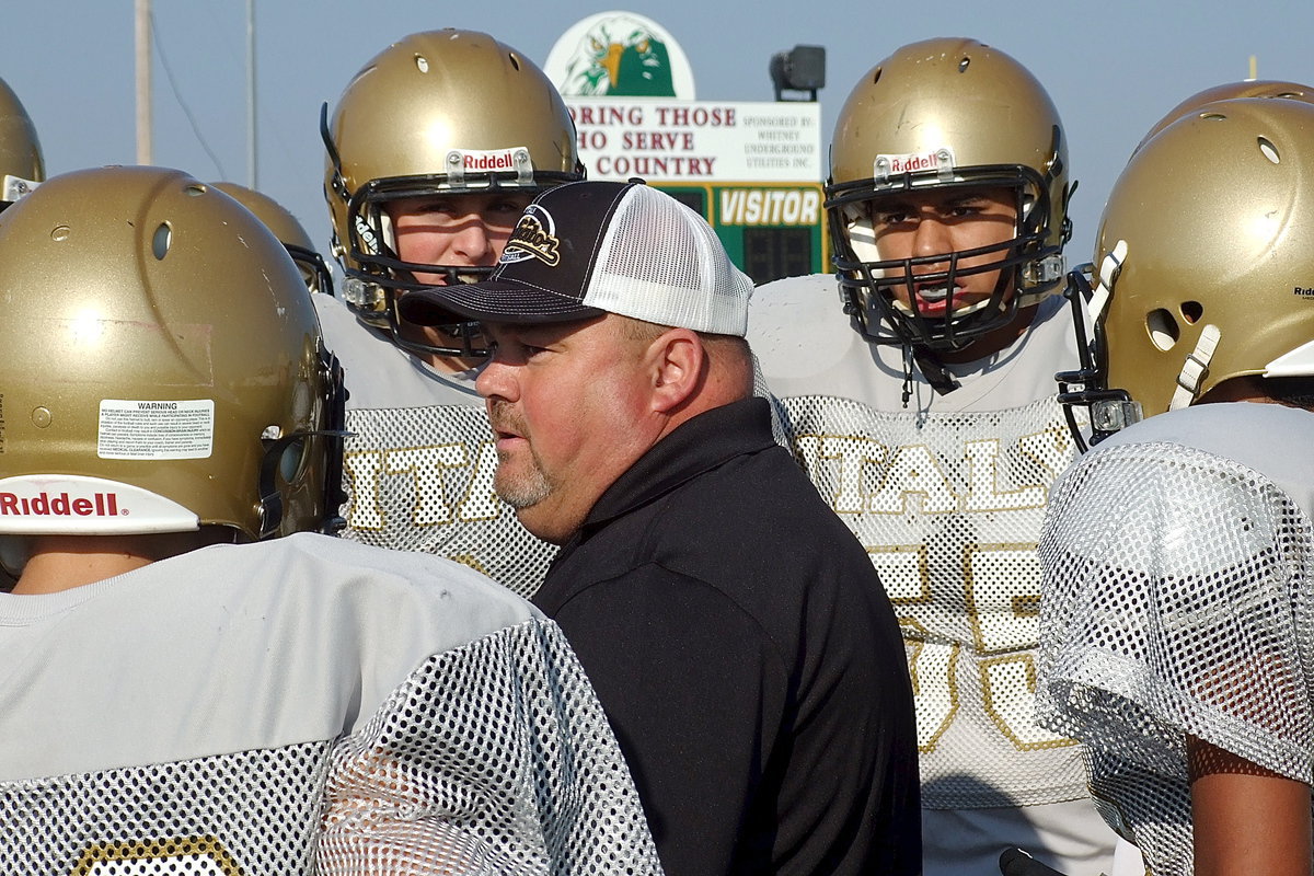 Image: Coach Rowe fires up the JV squad before their game.