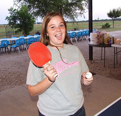Image: Reagan Cockerham is ready to serve during a spirited match of ping-pong.