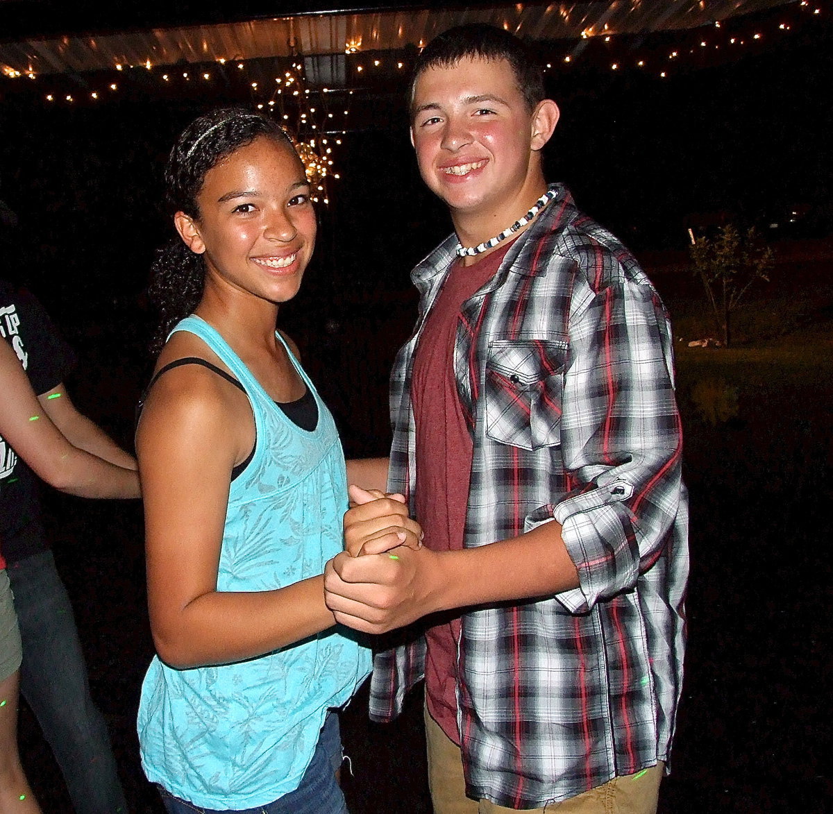 Image: April Lusk and Austin Crawford two-step under the lights.