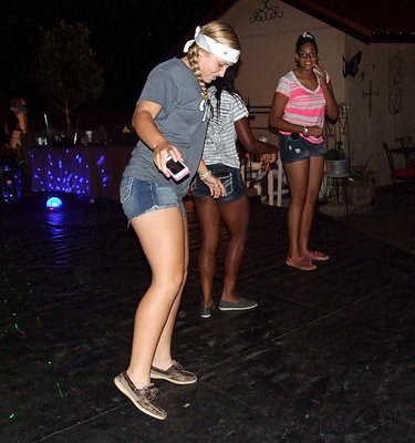 Image: Jaclynn Lewis, Kortnei Johnson and Oleshia Anderson show their moves on the dance deck.