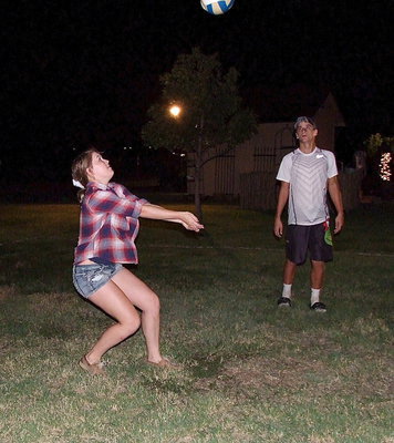 Image: Lady Gladiator volleyball player Taylor Turner shows Gladiator football player Levi McBride how its done.