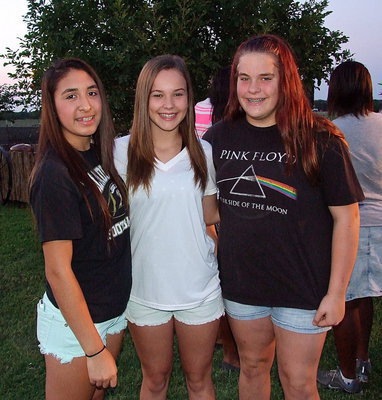 Image: Lizzy Garcia, Paige Little and Christy Murray visit during the bash.