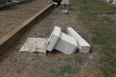 Image: This grave marker also received damage.