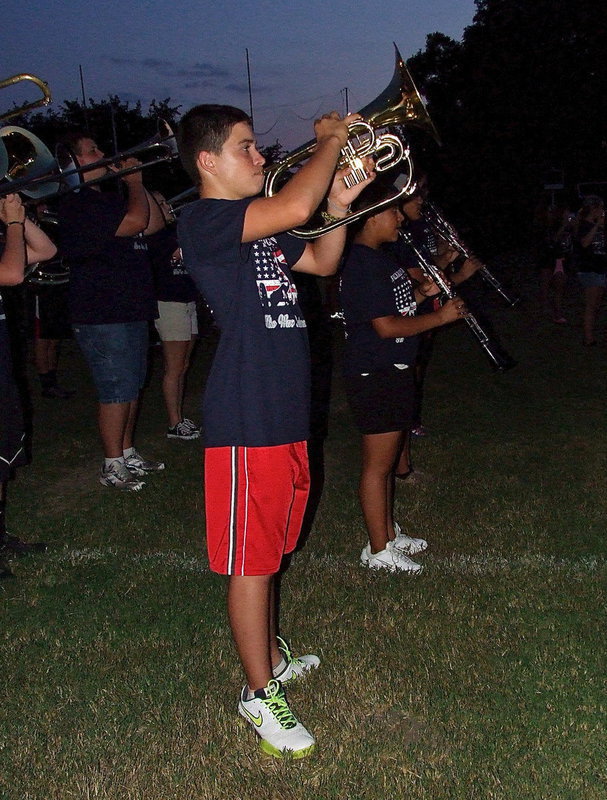 Image: Eli Garcia plays his horn loud and proud.