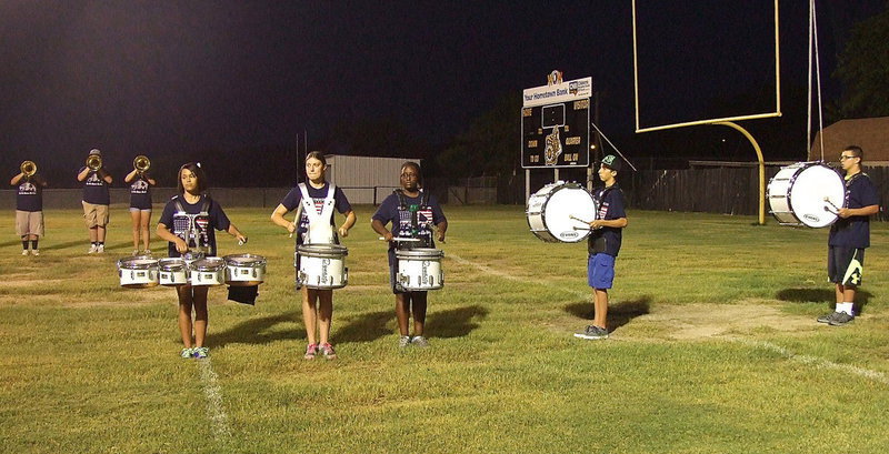Image: The drum-line with Alex Minton, Captain Whitney Wolaver, Brenya Williams, Noah Ramirez and Austin Crawford lead the charge.
