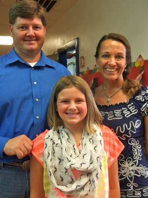 Image: Parents, Page and Monica Bishop, with their daughter Parys.