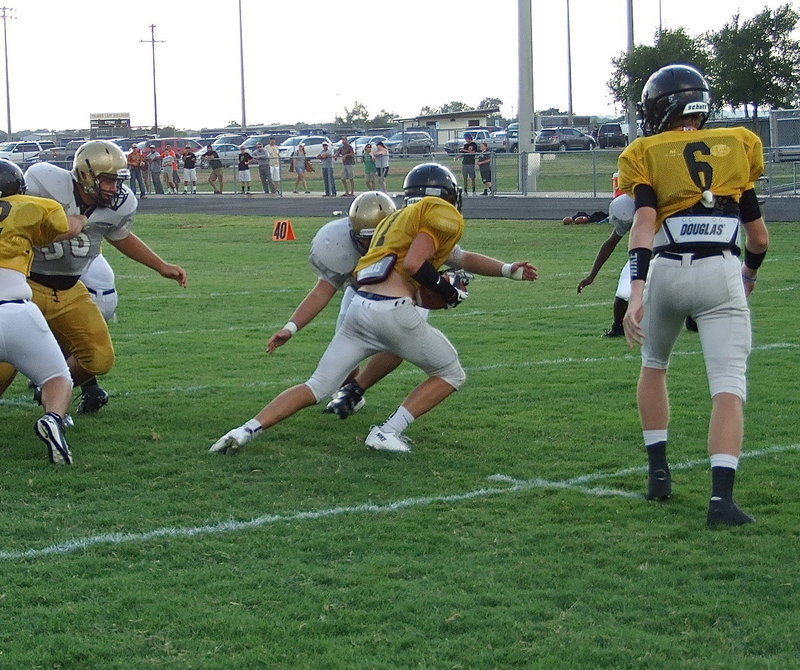 Image: Zain Byers(60) locates a Palmer back to help bring the Bulldog runner down for consecutive tackles to start the matchup for the senior end.