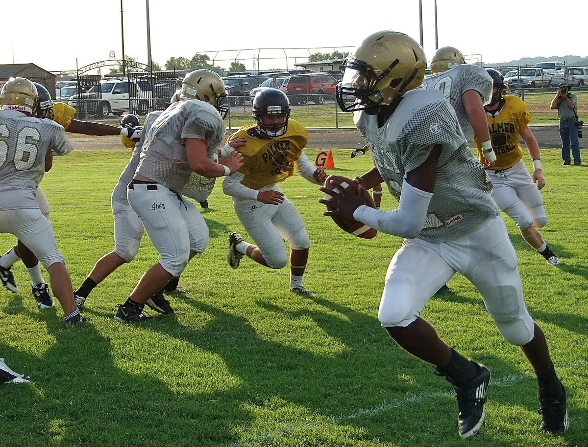 Image: Rolling out is Italy senior QB Tamarcus Sheppard behind blocks from Cody Medrano(66), Kyle Fortenbrry(75), Zain Byers(60) and Kevin Roldan(50).