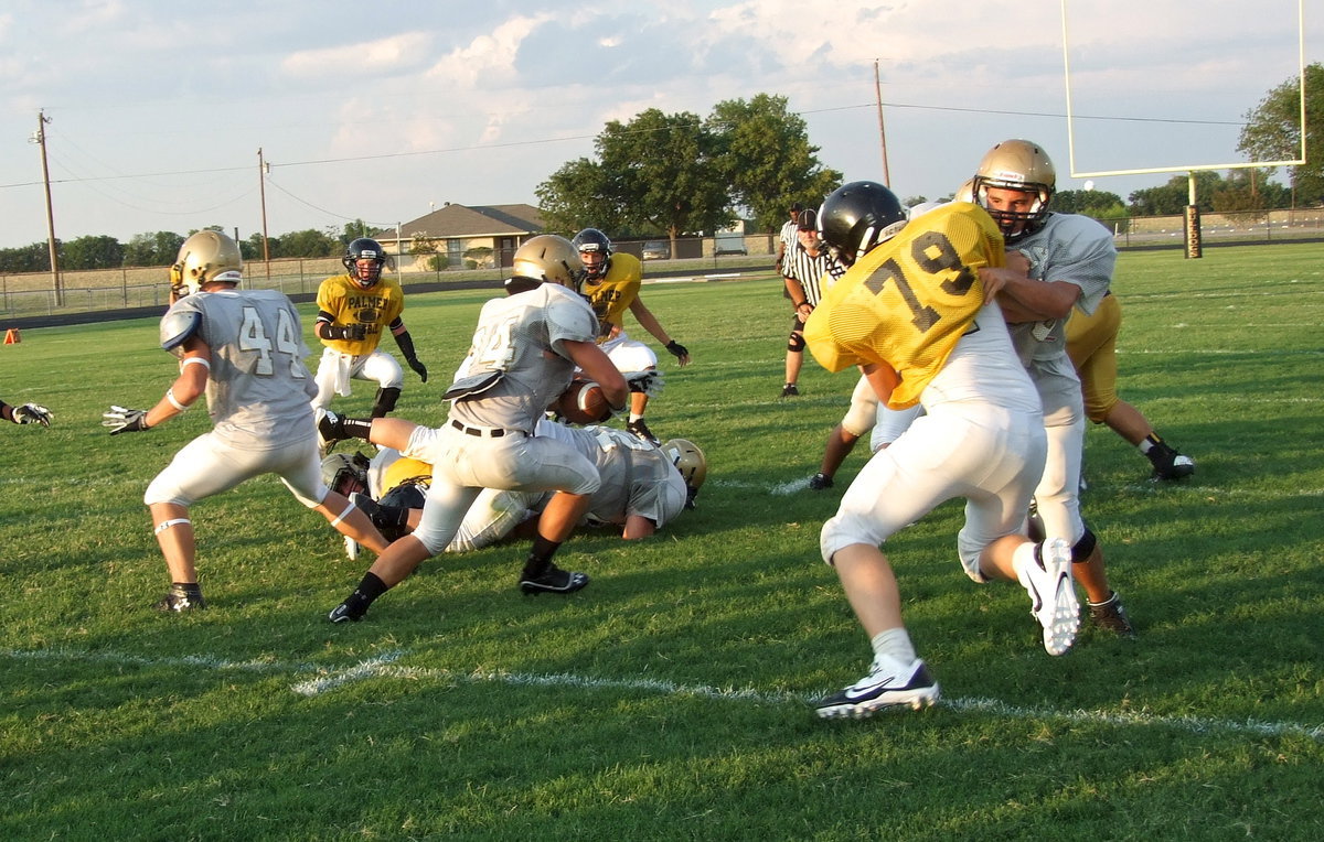 Image: Senior guard Cody Medrano(66) opens a running lane for senior fullback Shad Newman as Italy begins matriculating the ball upfield.