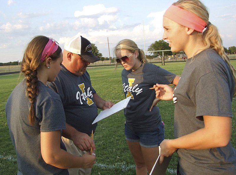 Image: The Lady Gladiator Stat Squad is back with Bailey Eubank, Hannah Washington and Jaclynn Lewis getting instructions from assistant coach Wayne Rowe.