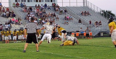 Image: There is that mighty tug mentioned in the article by tackle Kevin Roldan(60) who tracked down Palmer’s quarterback to help get him on the ground along with Bailey Walton(99) and bring a scoreless end to the scrimmage between Italy and Palmer.
