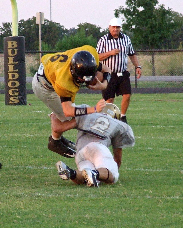 Image: Italy’s outside linebacker Hunter Merimon(2) upends Palmer’s quarterback.