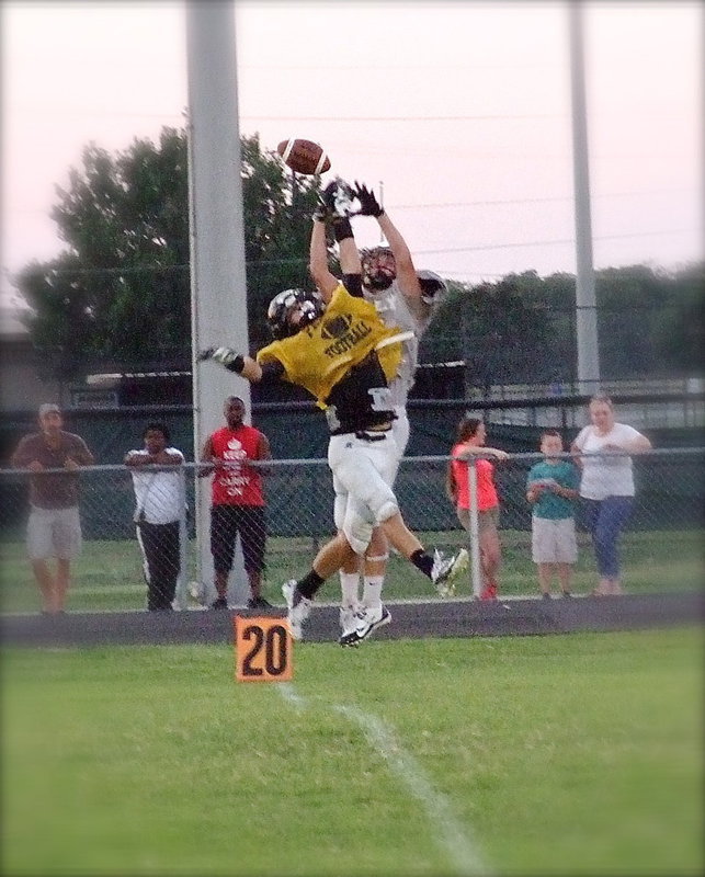 Image: With a big time defensive play for Italy is cornerback Cody Boyd(11) who leaps high to break up a pass attempt near the end of the simulated quarter. Boyd did it again on the next play when he deflected a pass in the end zone.