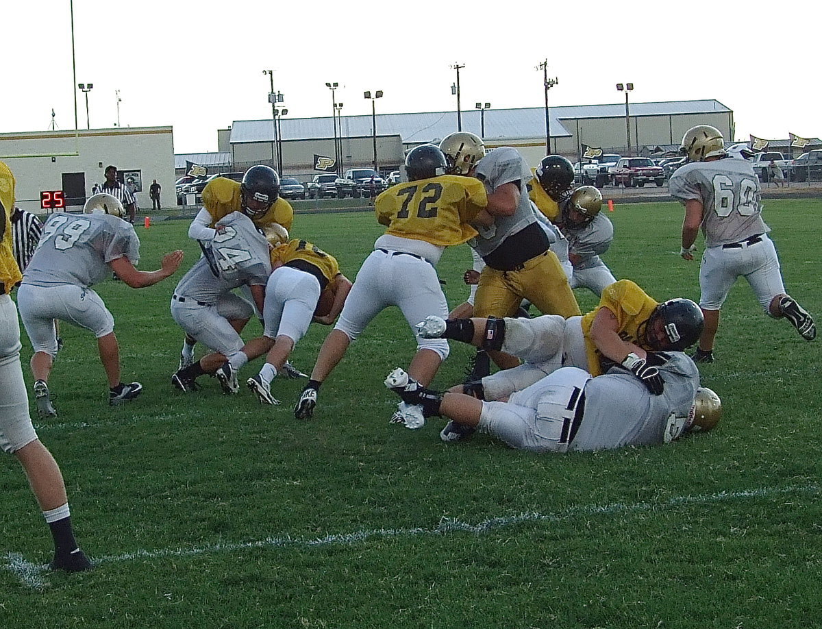 Image: Inside linebacker Shad Newman(24) manages to beat the block and trip up a Palmer running back.