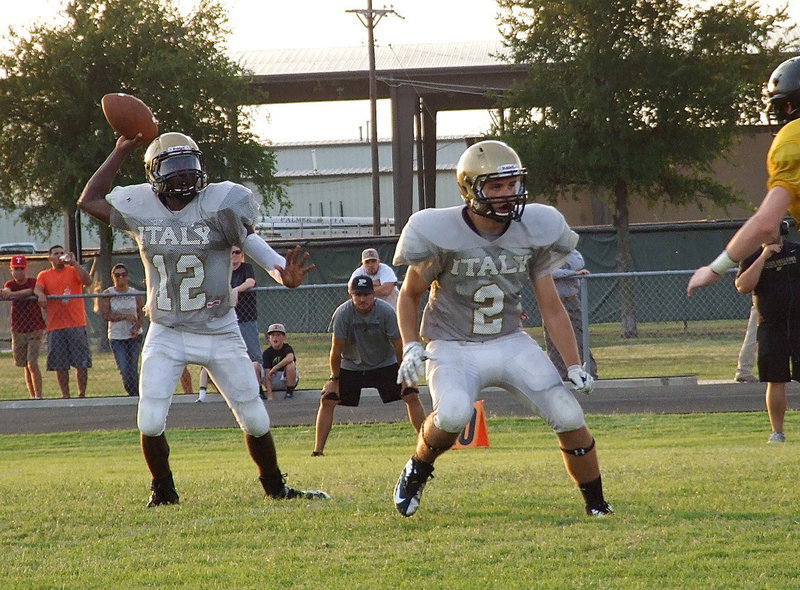 Image: Gladiator sophomore Hunter Merimon(2) pass protects for Tamarcus Sheppard(12).