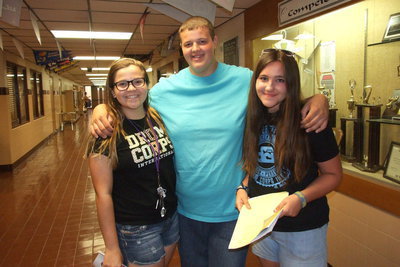 Image: Reagan Adams, Zac Mercer and Alexis Sampley take a time out while participating a mock run-through of their class schedule during Meet The Teacher Night at Italy High School.