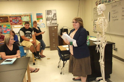 Image: Italy High School science teacher, Catherine Hewett, passes out her class outline to parents and students and makes no bones about having a great year!