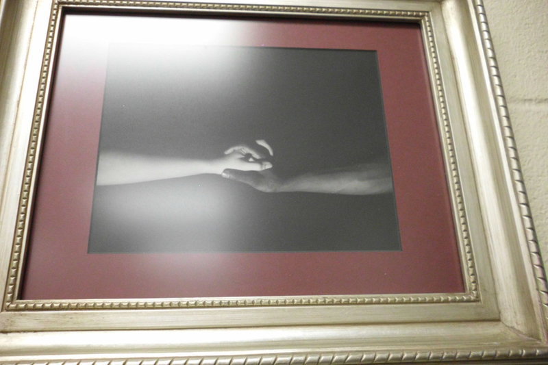 Image: This class assignment of “opposites” portrays the hands of her sister and her sister’s best friend. She captured large/small, male/female and black/white beautifully. The photography was purchased by a woman from Atlanta, Georgia.