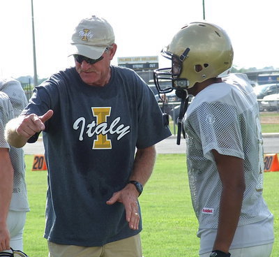 Image: Italy High School AD/HFC Charles Tindol coaches up Ray Salas.