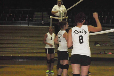 Image: 9th grade players, April Lusk, Brooke DeBorde and Paige Little defend the net.