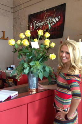 Image: Proprietor Ashlyn Rossa with her grand opening roses!