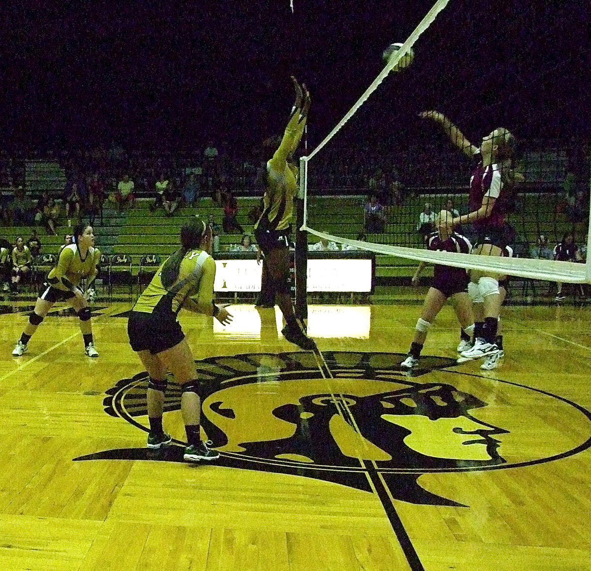 Image: Kortnei Johnson(12) rises at the net to help lift the Lady Gladiators 3-2 win over Mildred.