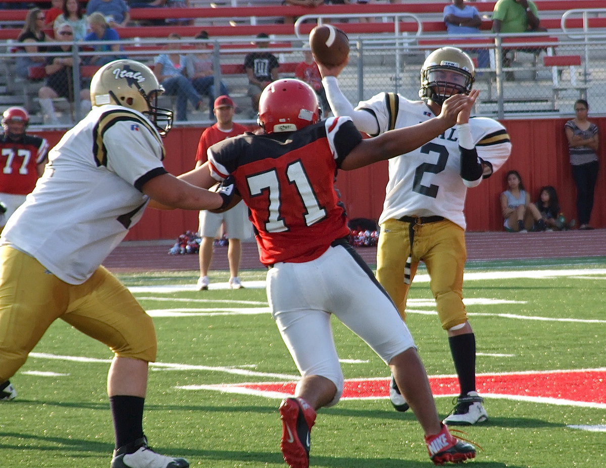 Image: Italy offensive tackle Aaron Pittmon(71) gives his quarterback Joe Celis(2) time to throw a pass.