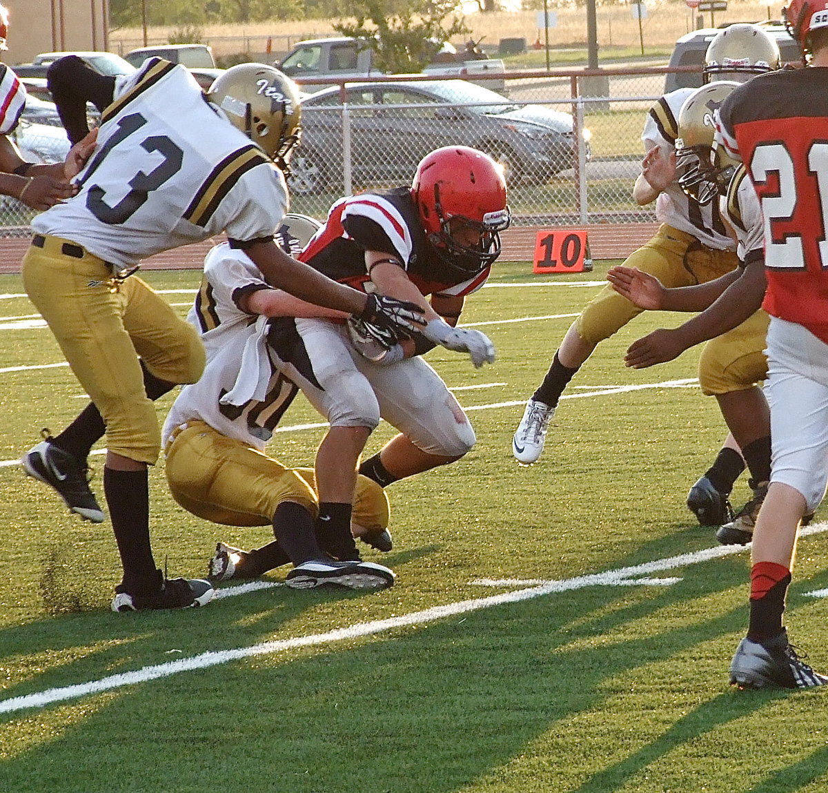 Image: Hunter Ballard(30) makes a special teams tackle for Italy on the ensuing kickoff.