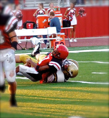 Image: Aaron Pittmon(71) breaks thru to stop a Maypearl runner for a loss in the backfield.