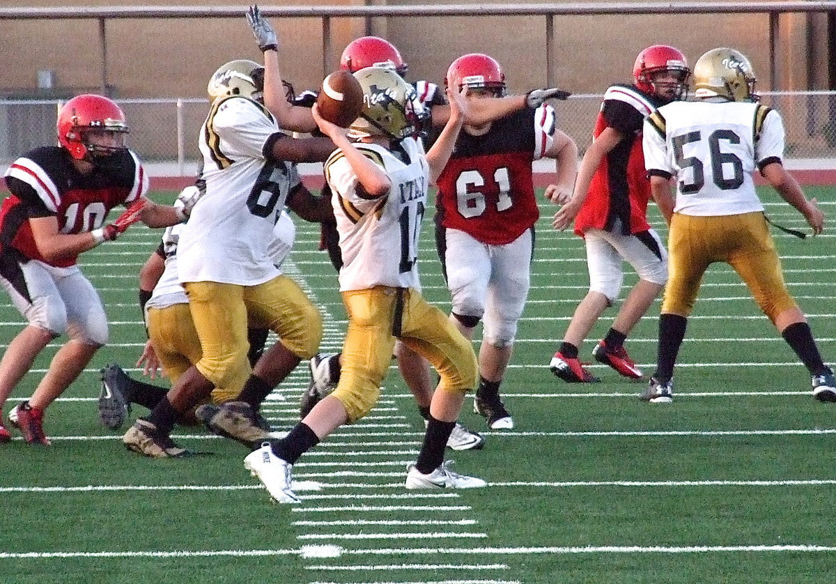 Image: Clayton Miller(10) steps in at quarterback and completes a pass downfield for Italy with Kenneth Norwood, Jr.,(63) and Austin Crawford(56) pass blocking.